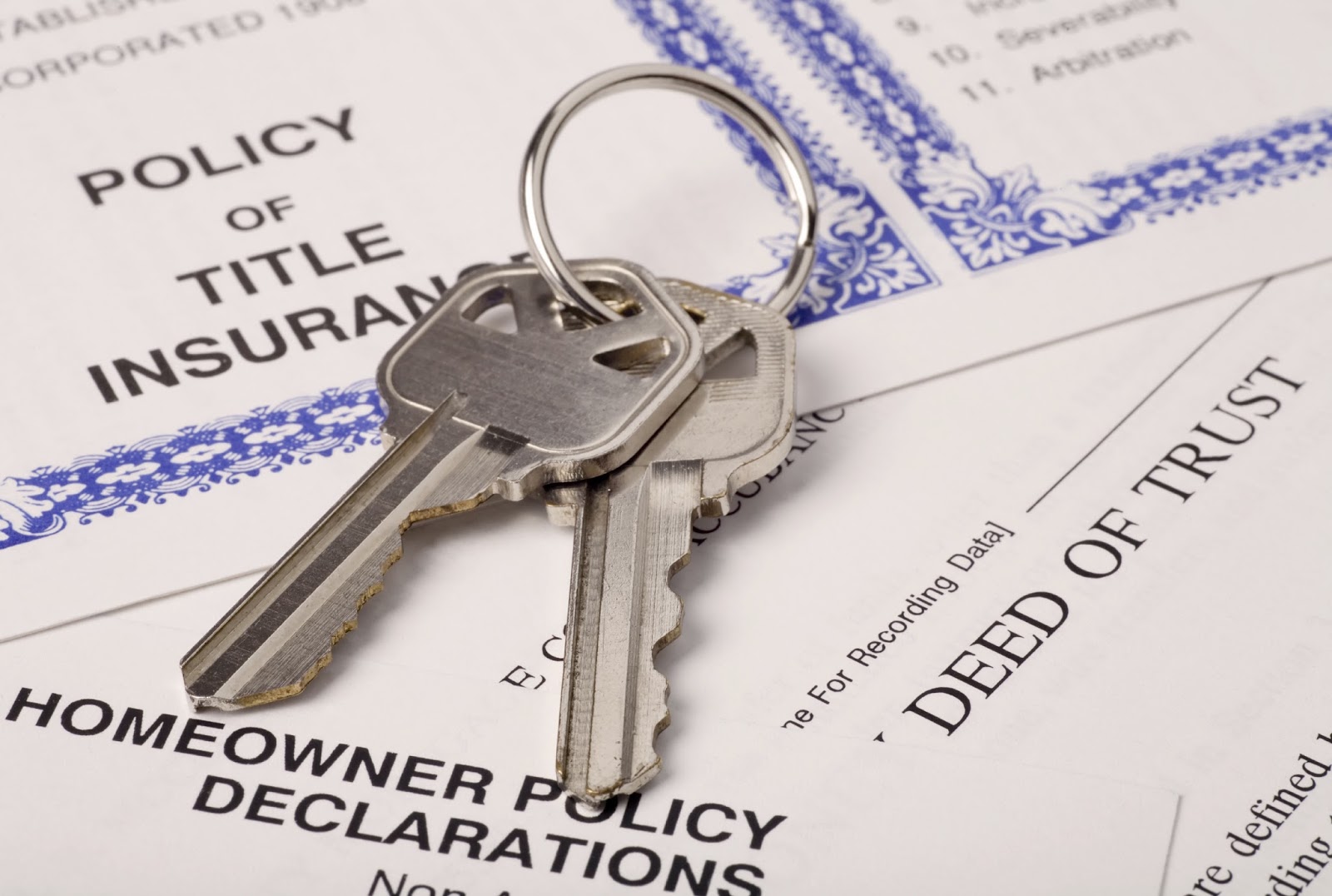 keys to house with home ownership documents